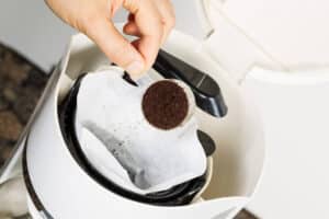 Coffee grounds into the bin-Toms Plumber
