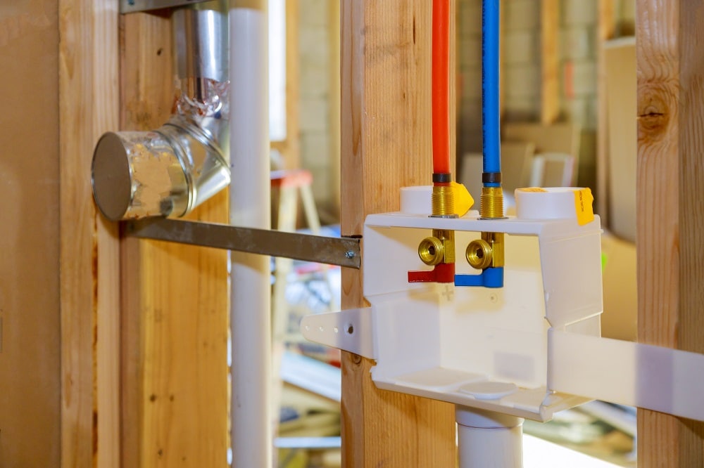 Interior framing of a plumbing outlet box for the laundry room in a new home under construction